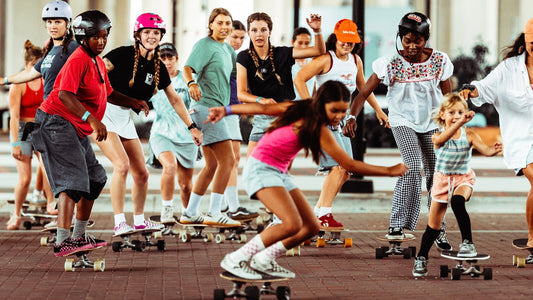 Group of women and girls longboarding together in downtown Jacksonville, Marloru Riverside Skate Park event June 2026