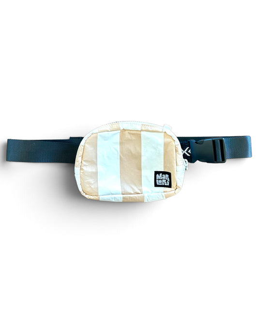 Sand Cabana Essentials Sling by Marloru, a sand striped crossbody belt bag shown on white