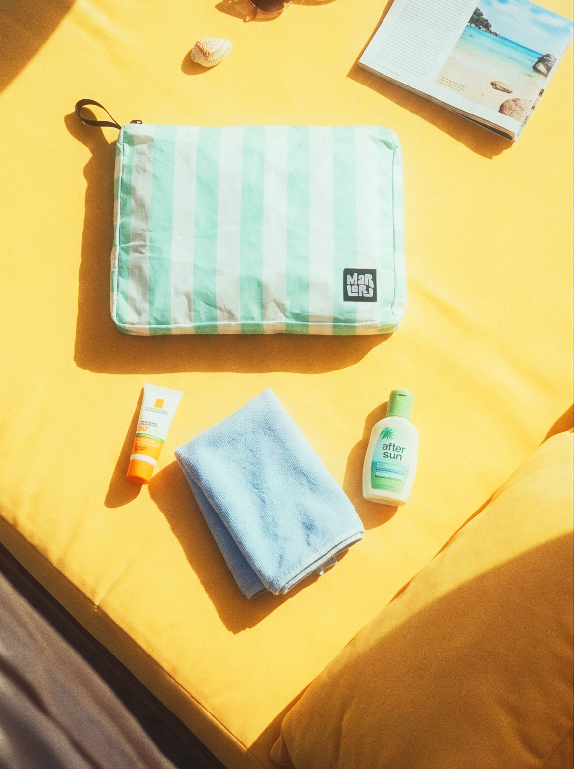 Seafoam Cabana Mid Pouch by Marloru, a seafoam-striped, splash-friendly 11 x 8.5 inch zip pouch